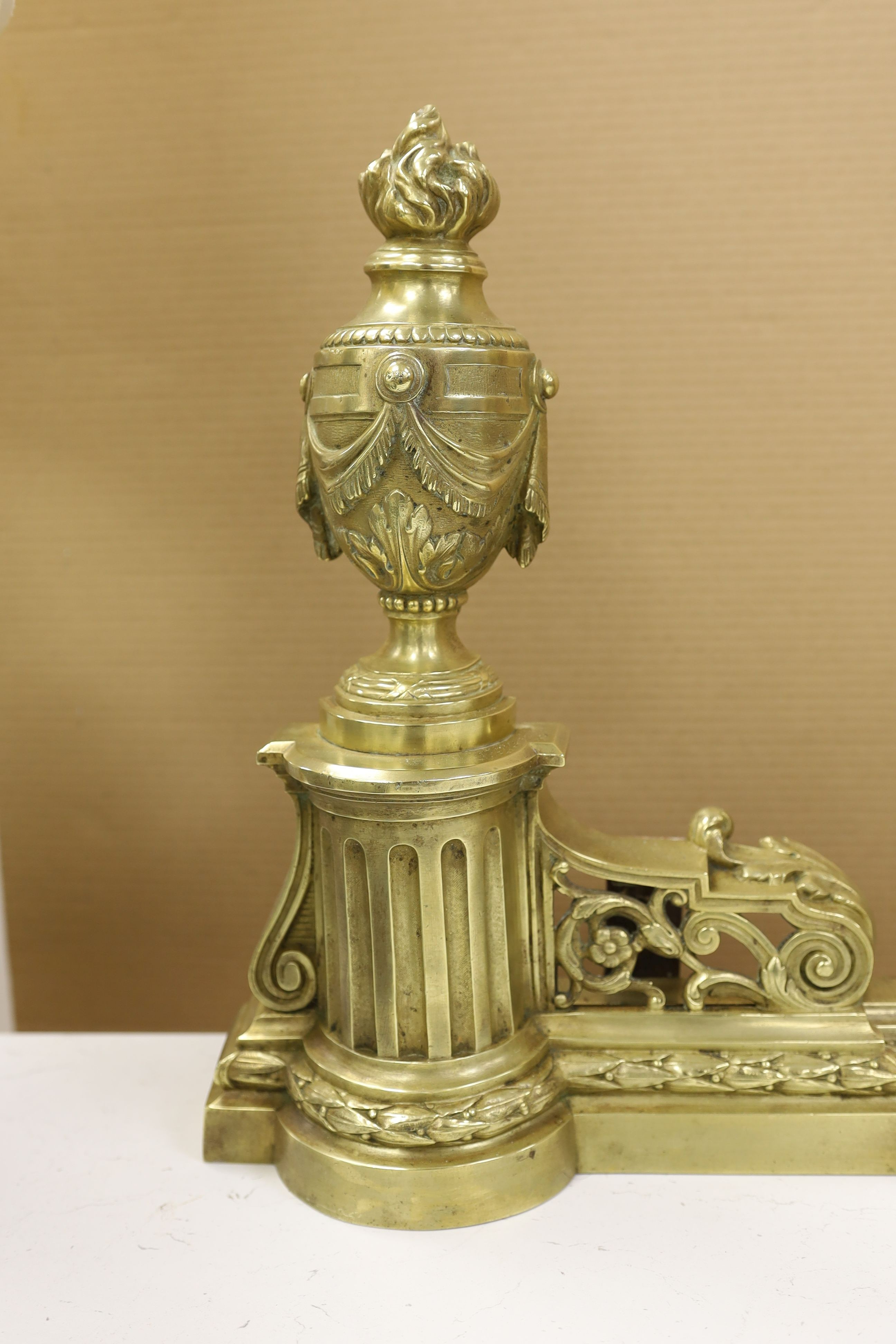 A Louis XVI style adjustable bronze chenet